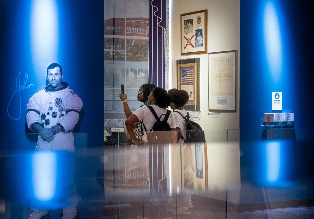 Three young people in Orlando Collected exhibit